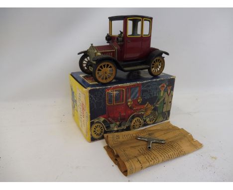 A boxed Schuco Old Timer model of a Ford Coupe, 1917. 