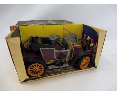 A boxed Schuco Old Timer model of a Renault, circa 1911. 