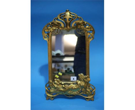 An Art Nouveau style gilt easel mirror.