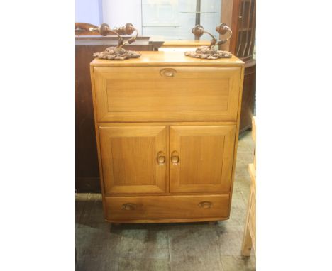 An Ercol writing desk, with fall front.