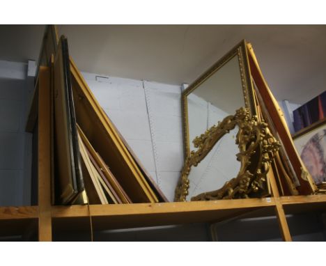 Shelf of mirrors and prints.