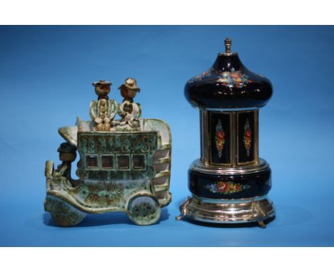 A musical cigarette holder and a ceramic bus.