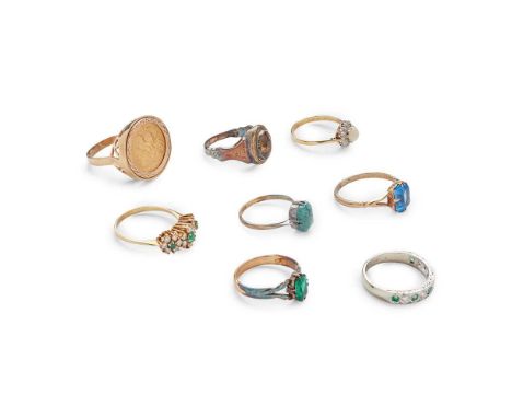 A collection of gem-set rings including a 9ct gold mounted 1914 half sovereign ring, an 18ct white gold emerald and diamond h