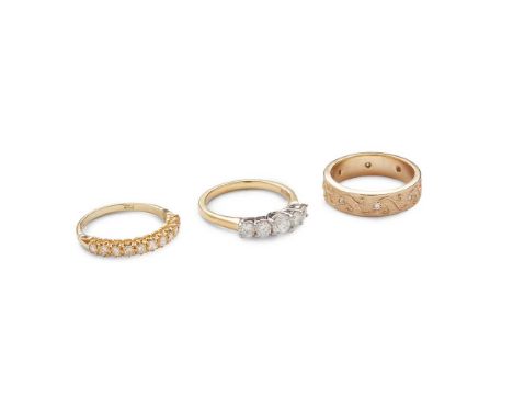 Three diamond rings including a graduated five-stone round brilliant-cut diamond ring, modelled in 18ct gold; an eleven stone