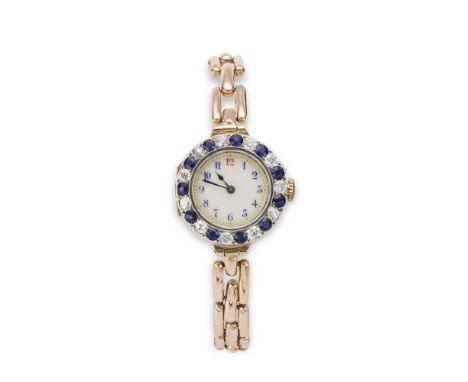 An early 20th-century sapphire and diamond wristwatch the white circular dial with blue and red Arabic numerals, bezel set wi