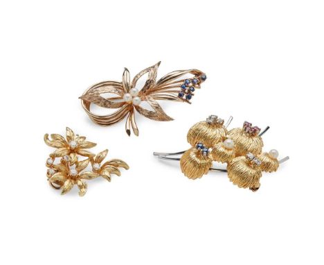 A collection of three floral brooches including a cultured pearl and sapphire spray brooch, modelled in 9ct gold; a diamond f