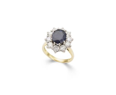 A sapphire and diamond cluster ring claw-set with an oval-cut sapphire, in a single border of ten round brilliant-cut diamond