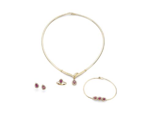 A suite of ruby and diamond jewellery comprising a necklace, bracelet, earrings and ring; each set with pear-shaped ruby and 