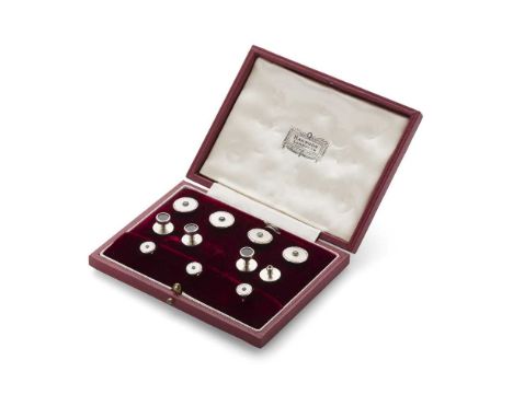 A gentleman's cased dress set comprising four buttons and three collar studs, each set with a small round-cut blue sapphire, 