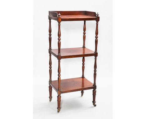 VICTORIAN MAHOGANY THREE TIER WHATNOT
with galleried top shelf on turned supports and castors, 143cm high 