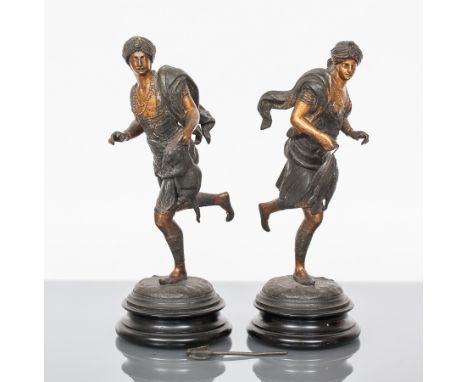 PAIR OF CONTINENTAL SPELTER FIGURES IN BERGMAN-STYLE
modelled as an Oriental male and female figure in active hunting poses, 