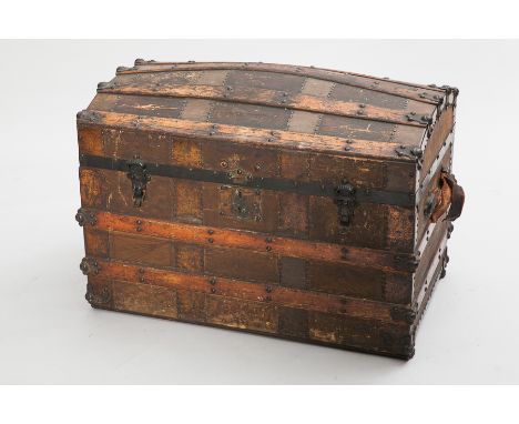 EARLY 20TH CENTURY IRON AND BRASS BOUND DOMED OAK TRUNK
with lock plate and clasps, stud decorations, canvas lined, 55cm high