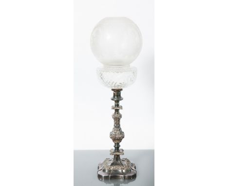 VICTORIAN CERAMIC FAUX TORTOISESHALL AND BRASS OIL LAMP 
with a detachable reservoir, with three scroll supports, on a circul