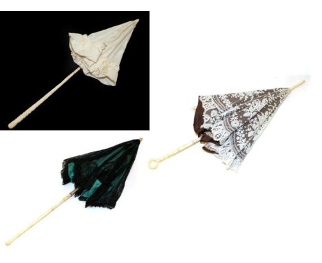 A 19th Century Brussels Bobbin Lace Parasol, the lower shaft of carved bone finishing in a loop. The scalloped lace cover fea