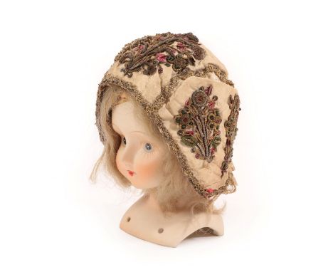 An 18th Century European Child's Cap worked in gold threads, and silver coiled thread, edged with gold braid, finished with a