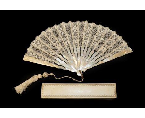 A Circa 1900/1910 Maltese Silk Lace Fan, the leaf mounted on white mother-of-pearl. The monture, with slightly serpentine sti