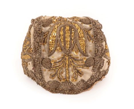 An Elaborate 18th Century European Child's Cap, suitable now for a doll, the cream silk ornately embroidered with flowers, po
