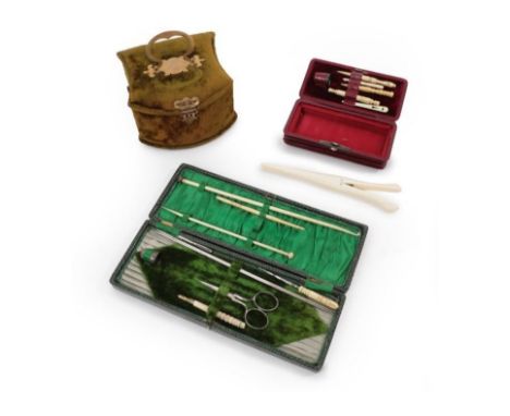 A 19th Century Maroon Leather Concertina Sewing Case with leather handle attached with brass loops on the outer lid, the base