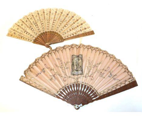 An Early 20th Century Cream Gauze Fan embroidered with gold sequins and spangles, mainly in vertical bands, mounted on lightl