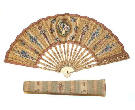 An Attractive Early 20th Century Silk Fan, being a pastiche of an earlier French fan, the double leaf mounted on carved and p