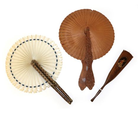 A Wood Cockade Fan with elaborately carved and shaped handles, these featuring scrolling leaves. The inner sticks are shaped 