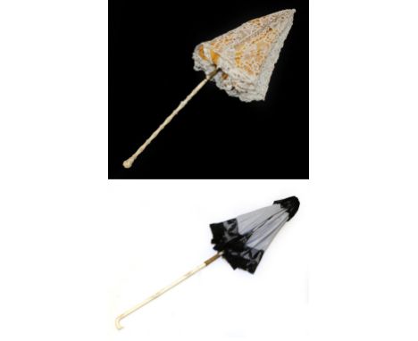 A Pretty 19th Century Folding Parasol with tape lace cover, relined recently, the lower shaft of ivory, carved with flowerhea