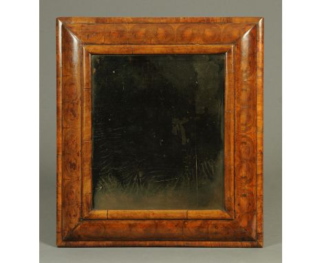 A William & Mary oyster veneered cushion framed wall mirror, with original mirror plate.  Overall dimensions 64 cm x 56.5 cm 