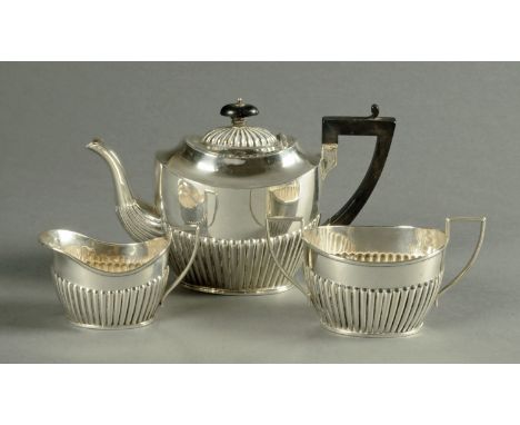 A three piece silver tea service, half lobed, 738 grams, London 1899 (see illustration).