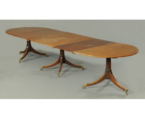 A George III mahogany three pillar dining table, comprising pair of D ends, centre section and two leaves.  Width 46.25" (117