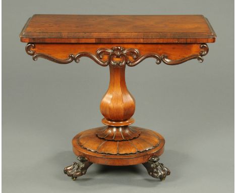 A William IV/early Victorian rosewood turnover top card table, with moulded edge and baize lined interior, raised on a facete