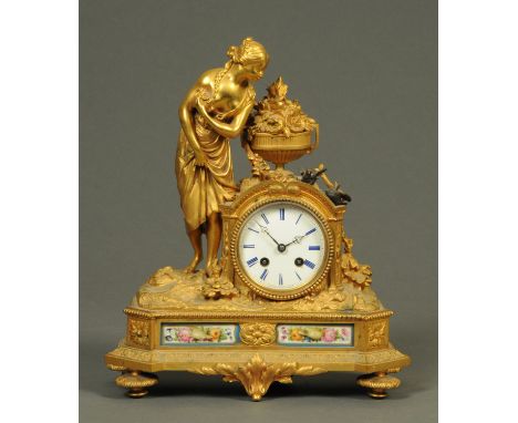 A French gilt metal figural mantle clock, the dial marked "Raingo Freres a Paris", with two-train striking movement.  Height 