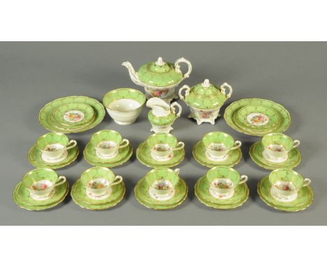 A late Victorian green white and gilt tea set, Rockingham style and with foliate pattern, comprising teapot, sucrier, milk ju