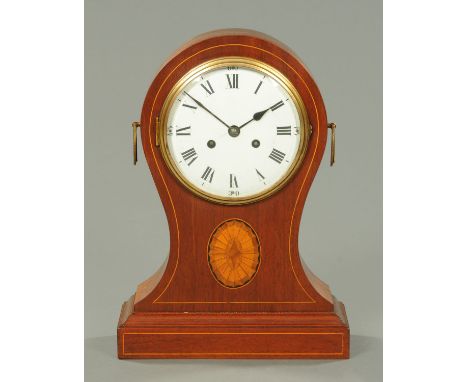A large Edwardian mahogany balloon clock, with two-train movement.  Height 43 cm, width 31 cm.    CONDITION REPORT:  The move