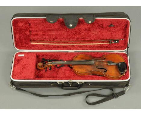 A violin, with Stradivarius trade label to the interior, with Torte bow.  Length of back 14 1/8 ins.    CONDITION REPORT:  Th