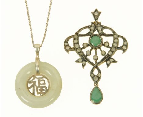 A silver and silver gilt Chinese jade pendant necklace, and an Edwardian silver gilt and paste diamond and emerald pendant. 