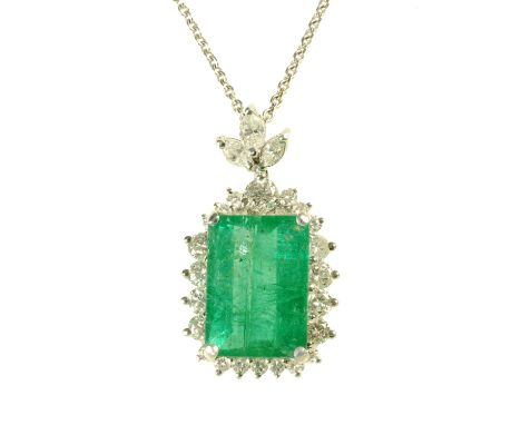 A large emerald and diamond cluster pendant, on 18 ct white gold chain, emerald weight +/- 9 carats, diamond weight +/- .88 c