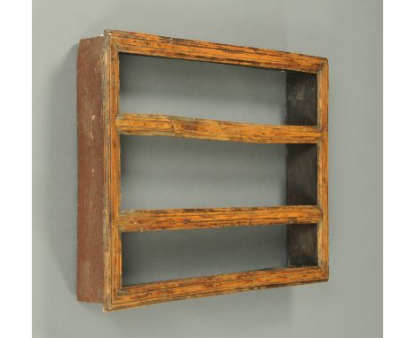 An 18th century provincial oak open wall rack, with moulded frame and three shelves.  Width 90 cm, height 67 cm (see illustra