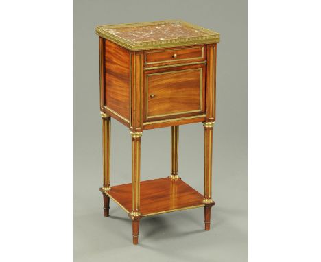 An early 20th century French bedside cabinet, with marble top, drawer and cupboard raised on turned legs with low shelf.  Wid