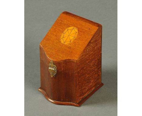A George III inlaid mahogany taperstick box, in the form of a knife box, with candlestick and tapers to the interior.  Height