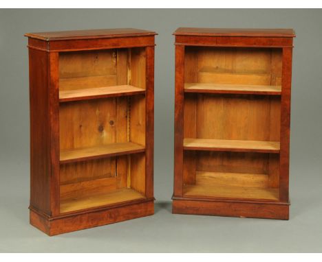 A pair of Victorian style mahogany open bookcases, each with moulded edge, recessed frieze, adjustable shelves and plinth bas