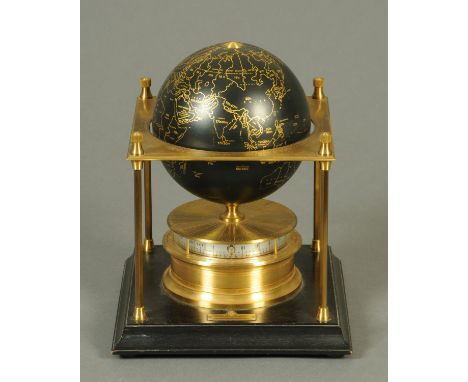 The Royal Geographical Society world clock, 1980, Copyright 1979, the rotating globe raised on a brass column and with wooden