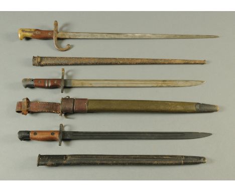 A World War I American Remington bayonet, a 1907 bayonet and an 1880 French bayonet in scabbard (see illustration).