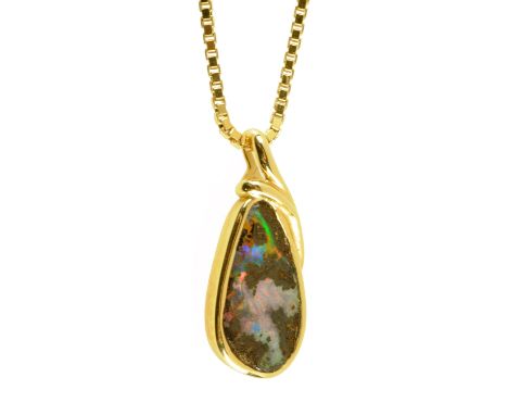 An 18 ct gold pendant, set with opal and with 9 ct gold chain.