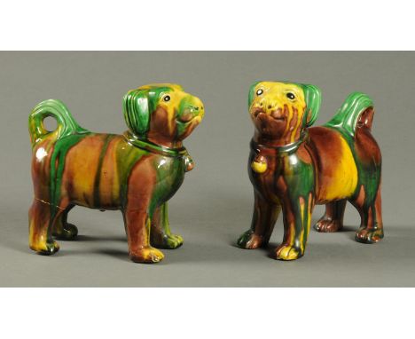 A pair of late 19th century Chinese glazed standing dogs.  Height 18 cm.    CONDITION REPORT:  One dog has a very small 1 mm 