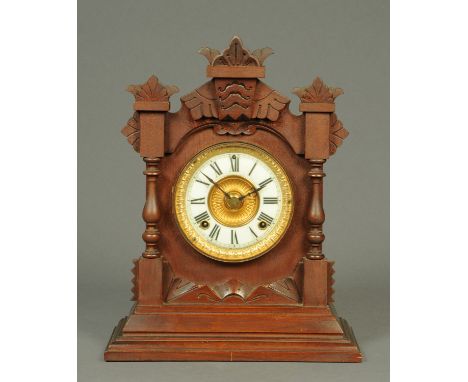 An Edwardian walnut cased Ansonia mantle clock, with two-train spring driven movement.  Height 38 cm. 