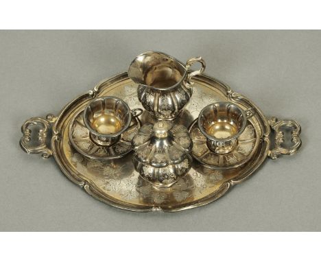 A Continental silver coloured metal miniature tea service.  Tray width 19 cm.