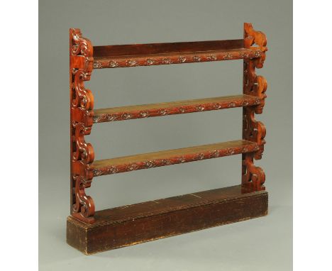 A Victorian rosewood open shelf unit, three tier plus base, with scroll and carved sides.  Width 120 cm. 