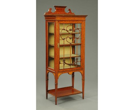 An Edwardian inlaid mahogany display cabinet, with rear upstand, single door with wooden astragals enclosing shelves, with op