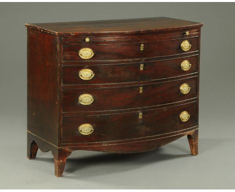 A George III mahogany bowfronted chest of drawers with slide, with four long graduated drawers with brass drop handles with e