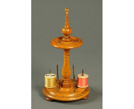 A 19th century Treen bobbin stand, raised on three short feet.  Height 28 cm. 